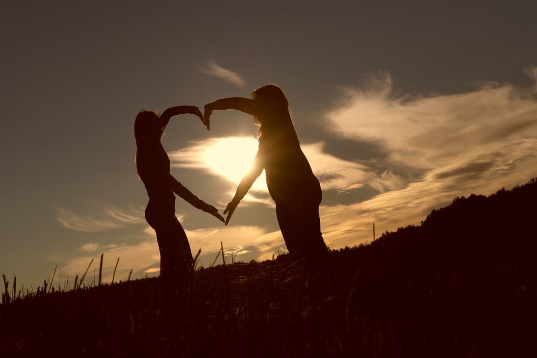 Two Persons Making Heart Shape with Body